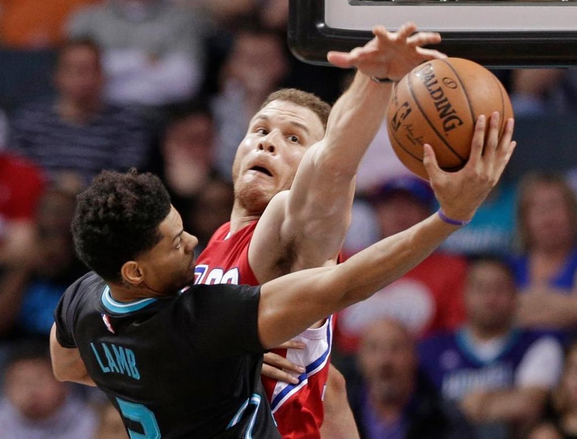 Los Angeles Clippers' Blake Griffin, right, blocks a shot by Charlotte Hornets' Jeremy Lamb, left, in the second half of an NBA basketball game in Charlotte, N.C., Sat., Feb. 11, 2017.