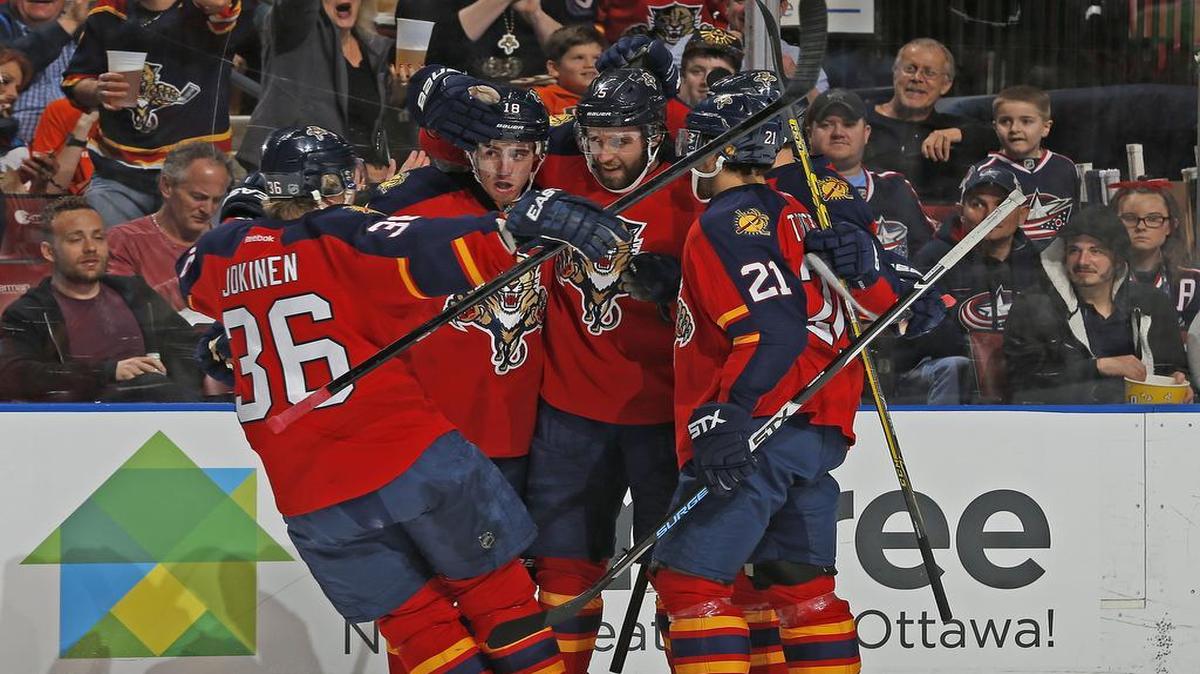 Florida Panthers defenseman Aaron Ekblad (5) (center) is congratulated by teammates after scoring a goal during the first period of an NHL hockey game against the Columbus Blue Jackets,, Sunday, Dec. 27, 2015, in Sunrise, Fla.