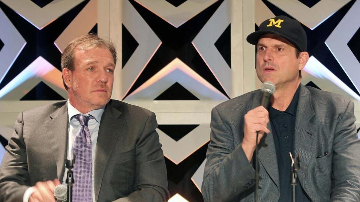Florida State University Seminoles head coach Jimbo Fisher, left, listens as University of Michigan Wolverines head coach Jim Harbough speaks at the annual Orange Bowl Coaches Luncheon at Jungle Island on Thursday, December 29, 2016