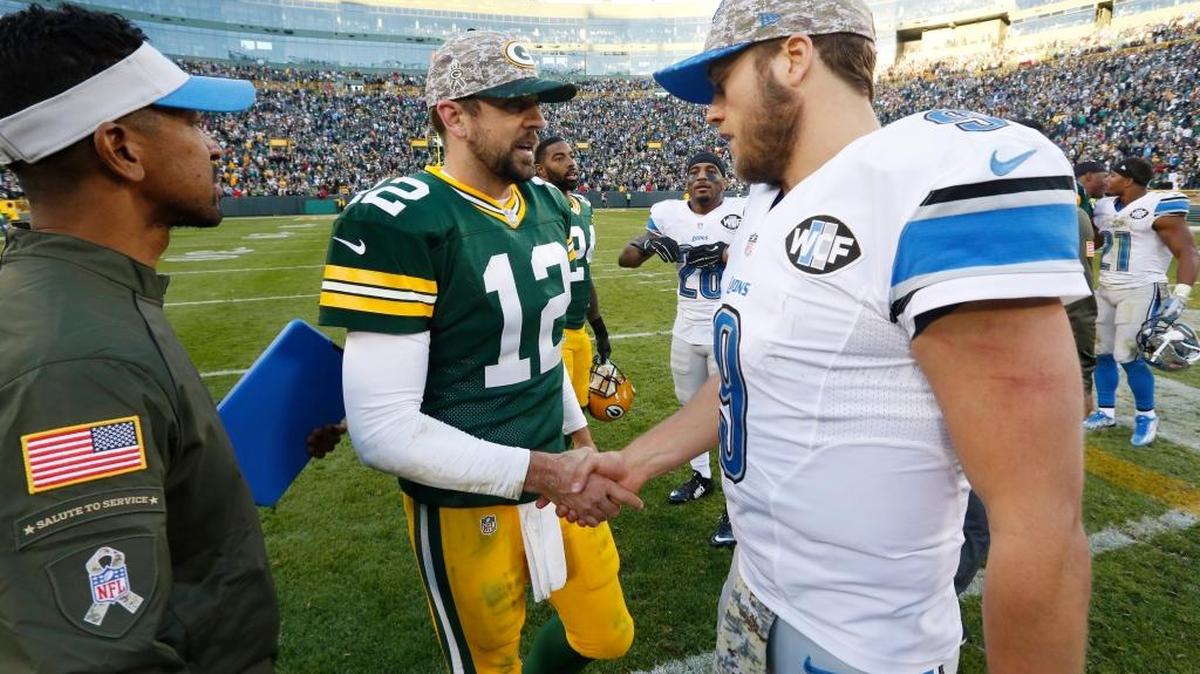 Green Bay Packers' Aaron Rodgers talks to Detroit Lions' Matthew Stafford after an NFL football game Sunday, Nov. 15, 2015, in Green Bay, Wis. The Lions won 18-16.