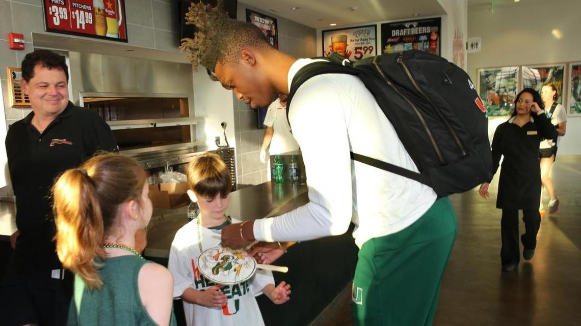 University of Miami guard Lonnie Walker signs autographs at the NCAA basketball selection show viewing party at the Rathskellar on UM’s Coral Gables campus on Sun., March 11, 2018, after the team was selected to play Loyola-Chicago of Illinois next Thursday in the first round of the South regional of the NCAA basketball tournament.