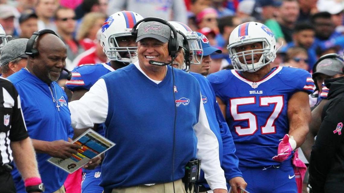 Buffalo Bills head coach Rex Ryan, center, stands with defensive coordinator Dennis Thurman, left, and outside linebacker Lorenzo Alexander (57) during the second half of an NFL football game against the San Francisco 49ers on Sun., Oct. 16, 2016, in Orchard Park, N.Y.
