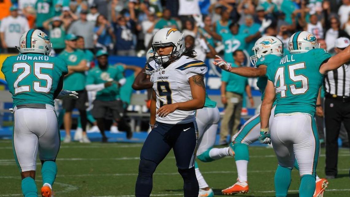 Los Angeles Chargers kicker Younghoe Koo (9) walks off the field after missing a field goal attempt in the final minute of an NFL football game against the Miami Dolphins Sunday, Sept. 17, 2017, in Carson, Calif.