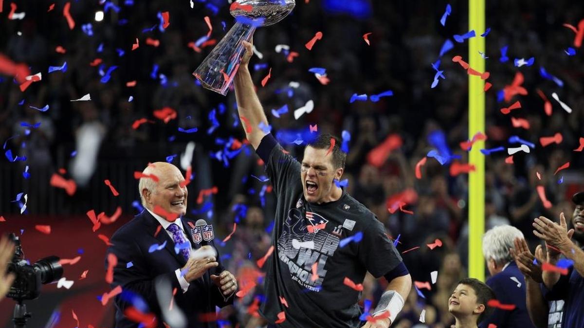 Patriots quarterback Tom Brady holds the Vince Lombardi Trophy and celebrates after defeating the Atlanta Falcons 34-28 in Super Bowl 51 at NRG Stadium on Feb. 5 in Houston, Texas. New England scored 19 points in the fourth quarter, including two two-point conversions, and rallied from a 25-point deficit to stun the Falcons in overtime. It was Brady’s fifth title.