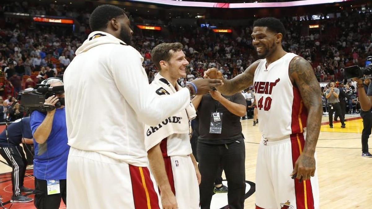 Miami Heat players Willie Reed, Goran Dragic and Udonis Haslem celebrate their 110-102 win against the Washington Wizards of an NBA basketball game at AmericanAirlines Arena in Miami on Wed., March 12, 2017.