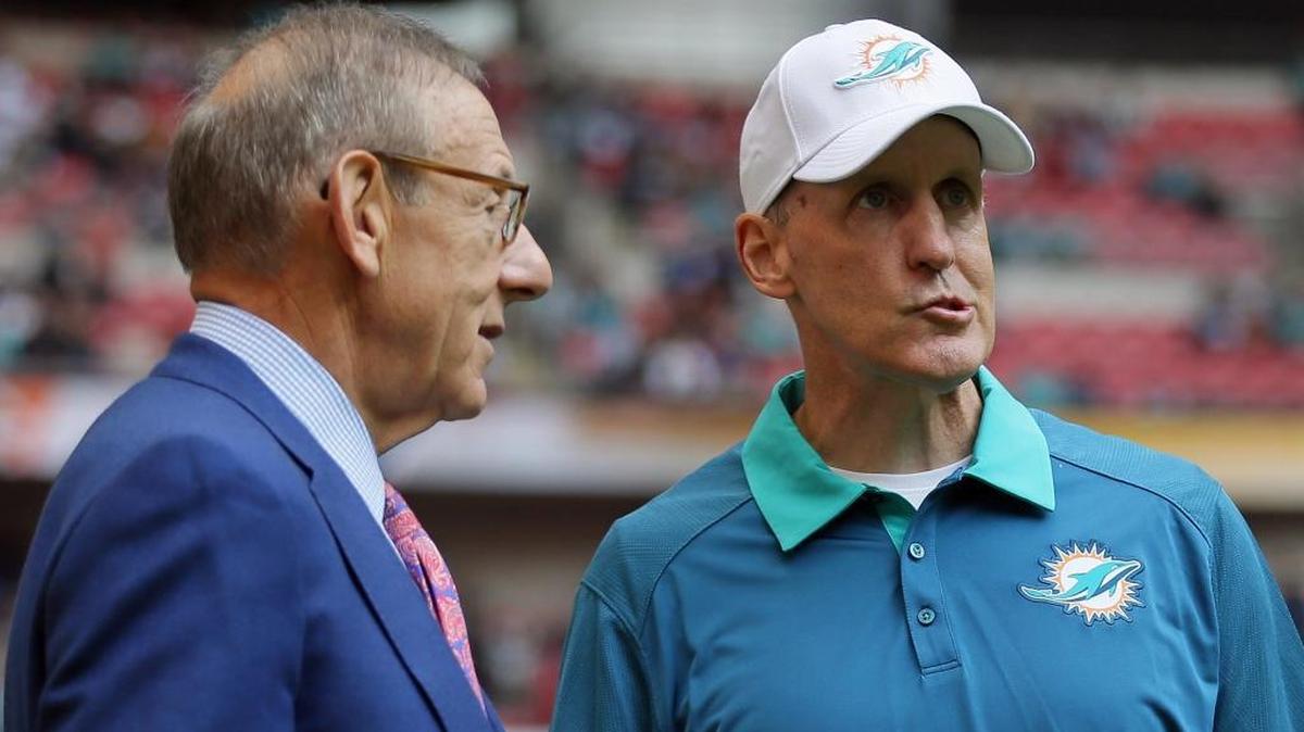 
Miami Dolphins owner Stephen Ross, left, and head coach Joe Philbin chat during warm-up before the NFL football game between the New York Jets and the Miami Dolphins at Wembley stadium in London. Philbin was fired Monday, Oct. 5, 2015.
