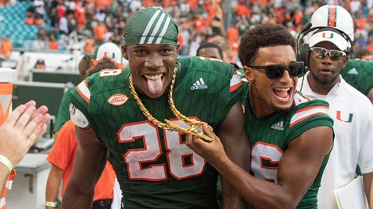 Canes defensive back Michael Jackson celebrates with the Turnover Chain earlier this season. UM coach Mark Richt should be celebrating too for being ranked one spot behind Clemson.