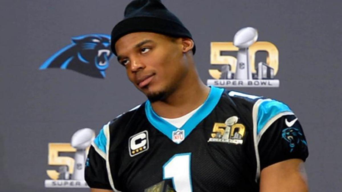 Carolina Panthers QB Cam Newton appears exasperated as he answers a question during a media interview Thursday, February 4, 2016 in preparation for Super Bowl 50. “How can I reword answers to questions I’ve been asked so many times?” Newton said. “Nothing much has changed since I’ve seen you guys 24 hours ago [except that] I had an unbelievable sleep. I sound like a broken record.”