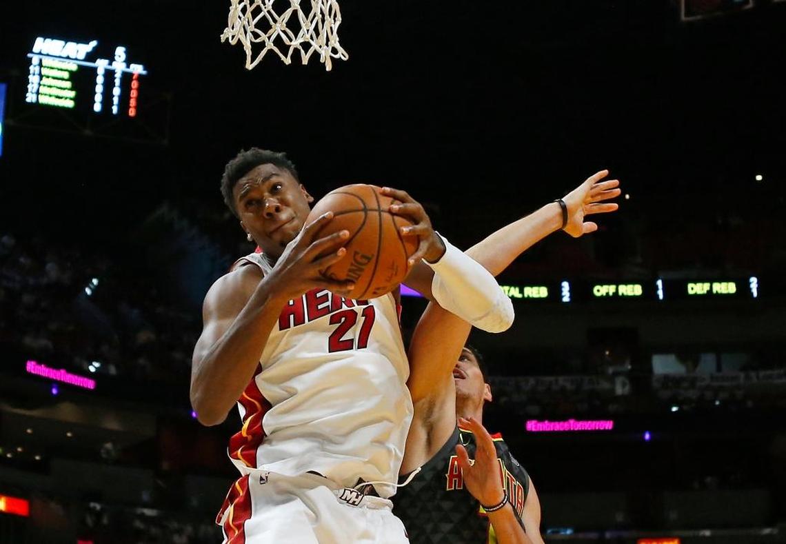 Miami Heat center Hassan Whiteside pulls down a rebound against Atlanta Hawks forward Ersan Ilyasova #7 during the first quarter of an NBA preseason basketball game at the AmericanAirlines Arena in Miami on Sunday, Oct. 1, 2017.