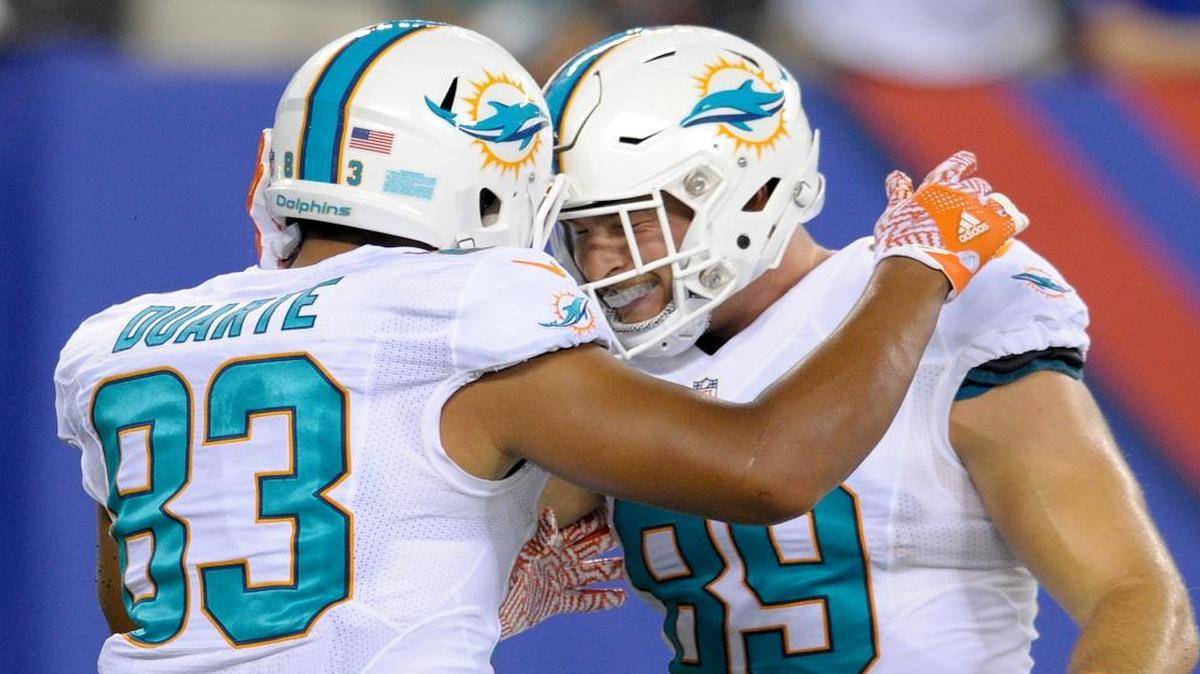 Miami Dolphins tight end Thomas Duarte (83) celebrates with tight end Gabe Hughes (89) after scoring a touchdown against the New York Giants during the fourth quarter of a preseason NFL football game, Friday, Aug. 12, 2016, in East Rutherford, N.J.