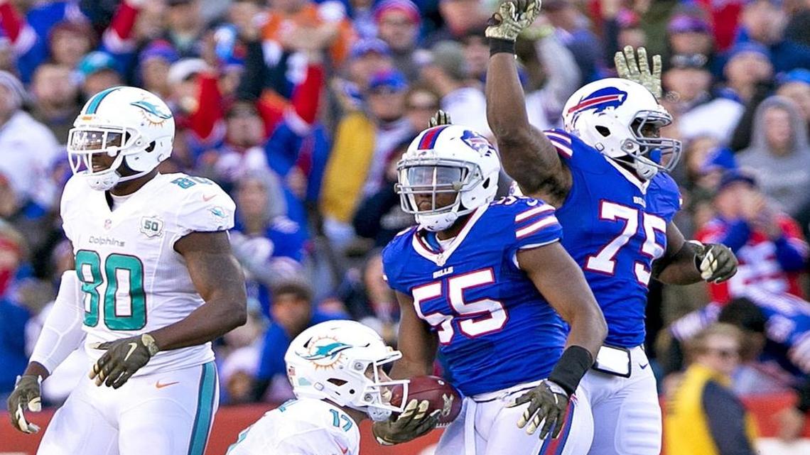 Miami Dolphins quarterback Ryan Tannehill (17) is sacked and fumbles to ball as Buffalo Bills defensive end Jerry Hughes (55) recovers in the third quarter. Buffalo Bills host the Miami Dolphins at Ralph Wilson Stadium, Orchard Park, N.Y. on Sun., Nov. 8, 2015.