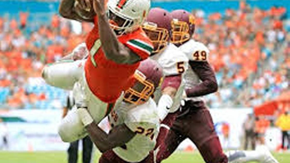 Canes running back Mark Walton, shown scoring against Bethune-Cookman Saturday, ranks third in the season’s first State Offensive Player of the Year rankings.