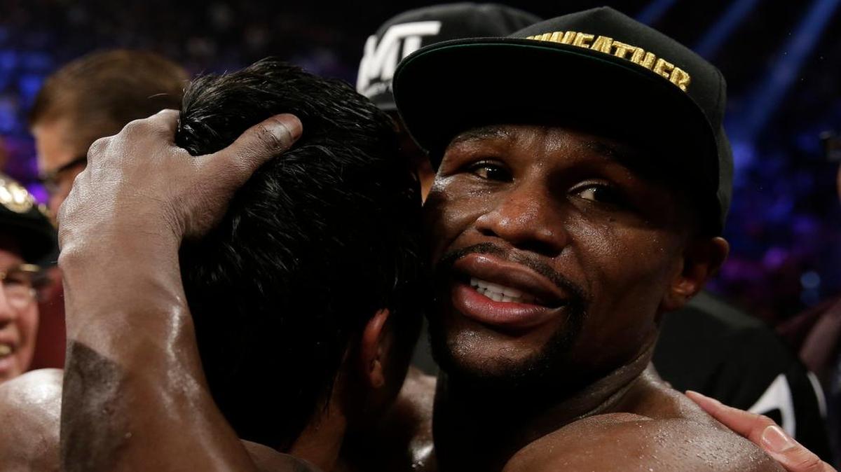 
Floyd Mayweather Jr., right, hugs Manny Pacquiao, from the Philippines, after their welterweight title fight on Saturday, May 2, 2015 in Las Vegas.
