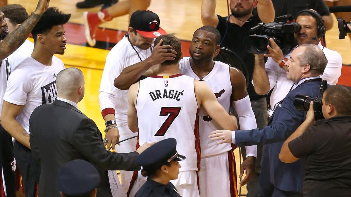 Heat guard Goran Dragic gets a hug from Dwyane Wade after Miami’s victory over Toronto in Game 6 of the Eastern Conference semifinal series.
