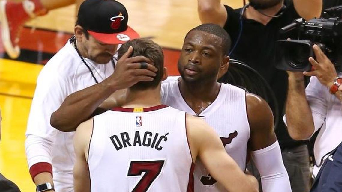 Miami Heat guard Dwyane Wade,(3) hugs teammate Goran Dragic after they defeated the Toronto Raptors 103-91 in Game 6 of the NBA Eastern Conference semifinal series at AmericanAirlines Arena in Miami on Fri., May 13, 2016.