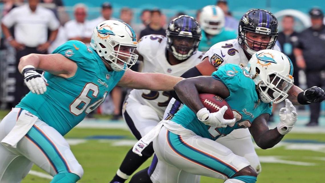 Dolphins Jay Ajayi (23) runs the ball in the first quarter as the Miami Dolphins play the Baltimore Ravens in their second preseaon game at Hard Rock Stadium in Miami Gardens.