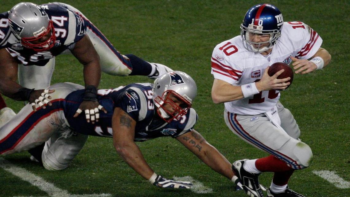 Eli Manning, above, and the Giants, who have beaten the Patriots in two Super Bowls, will try to knock Tom Brady and the Patriots from the ranks of the unbeaten.