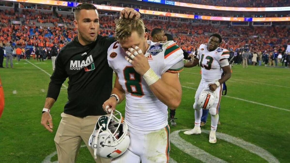 A dejected University of Miami wide receiver Braxton Berrios (8) walks off the field after the Hurricanes were defeated by the Clemson Tigers 38-3 in the ACC Championship Game at Bank of America Stadium in Charlotte, N.C. on Saturday, Dec. 2, 2017.