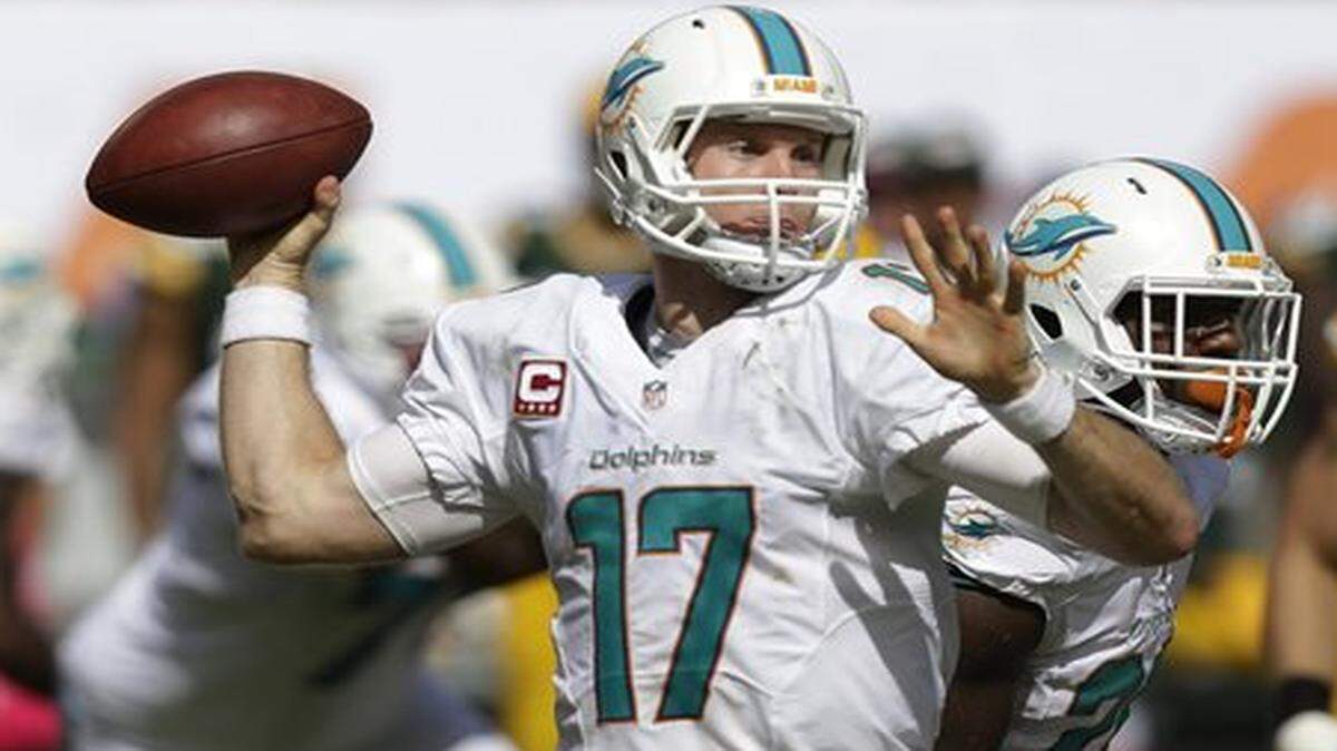 Miami Dolphins quarterback Ryan Tannehill (17) looks to pass during the second half of an NFL football game against the Green Bay Packers, Sunday, Oct. 12, 2014, in Miami Gardens, Fla.