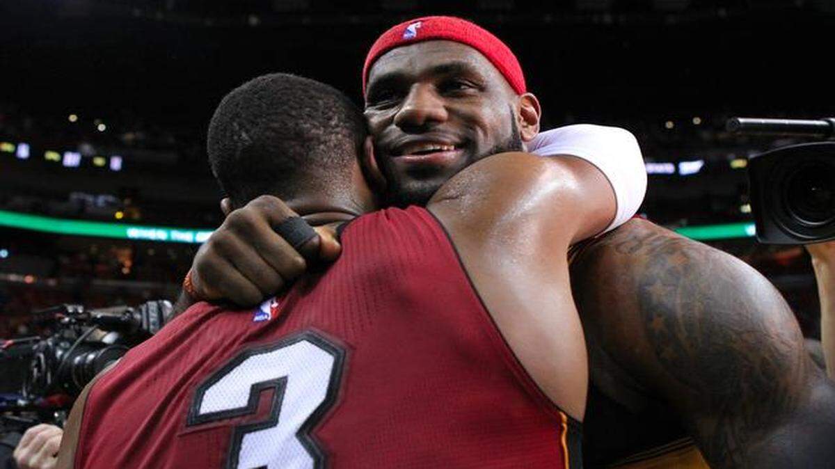 
Still friends: Miami Heat guard Dwyane Wade (3) hugs former teammate Cleveland Cavaliers forward LeBron James after an NBA basketball game at the AmericanAirlines Arena in Miami on Thursday, December 25, 2014. 
