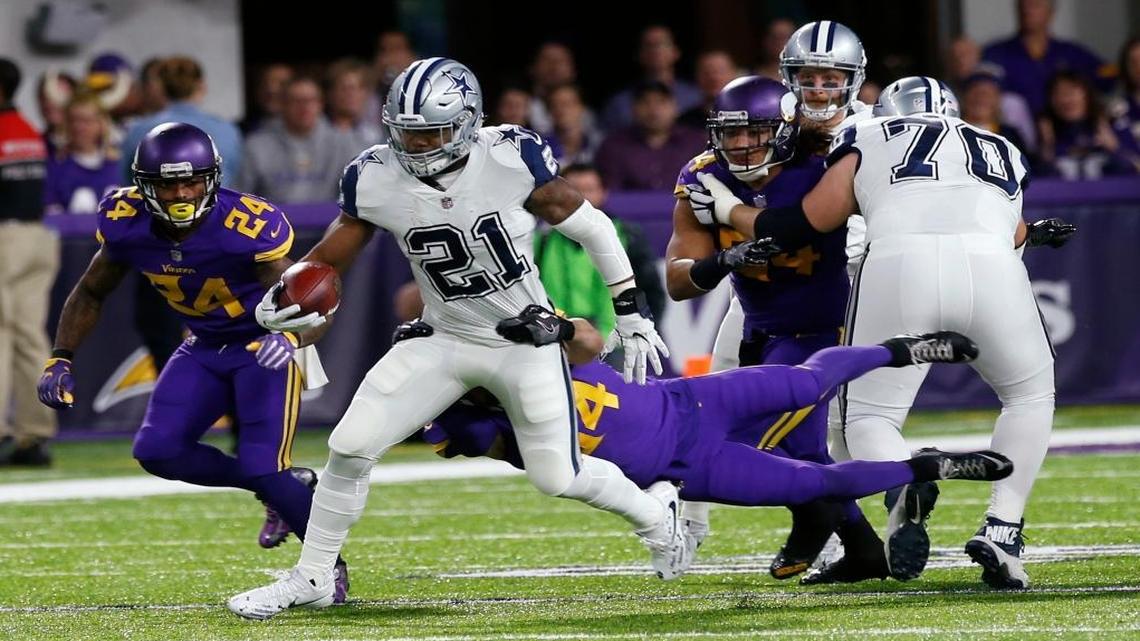 Dallas Cowboys running back Ezekiel Elliott (21) tries to break a tackle by Minnesota Vikings strong safety Andrew Sendejo during the first half of an NFL football game Thurs., Dec. 1, 2016, in Minneapolis.