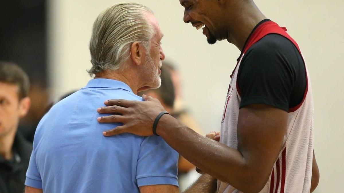 Miami Heat president Pat Riley, left, and Chris Bosh must make a decision on the center. It will be key to the future of the team.