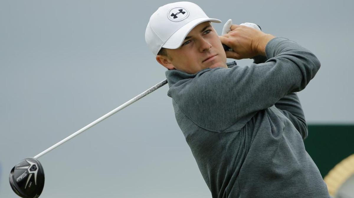 
United States’ Jordan Spieth drives a ball from the fifth tee during the first round of the British Open Golf Championship at the Old Course, St. Andrews, Scotland, Thursday, July 16, 2015. 
