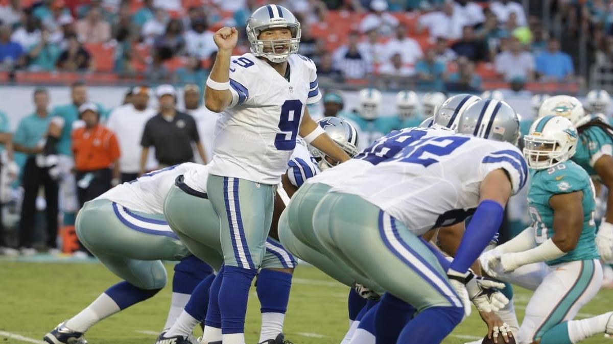 Dallas Cowboys quarterback Tony Romo (9) calls a play during a preseason game against the Dolphins on Saturday, Aug. 23, 2014 in Miami Gardens, Fla.
