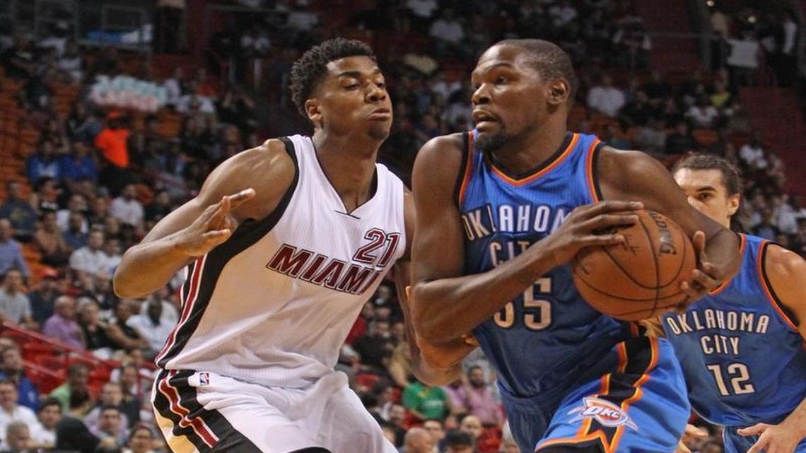 Miami Heat’s Hassan Whiteside tries to stop Oklahoma City Thunder’s Kevin Durant during the first quarter Thursday, Dec. 3, 2015 at the AmericanAirlines Arena.