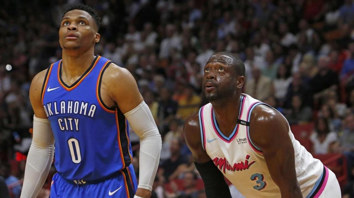 Heat guard Dwyane Wade and Oklahoma City Thunder guard Russell Westbrook jockey for position in a game on Monday night. For the first time in his postseason career with the Heat, Wade will be coming off the bench.