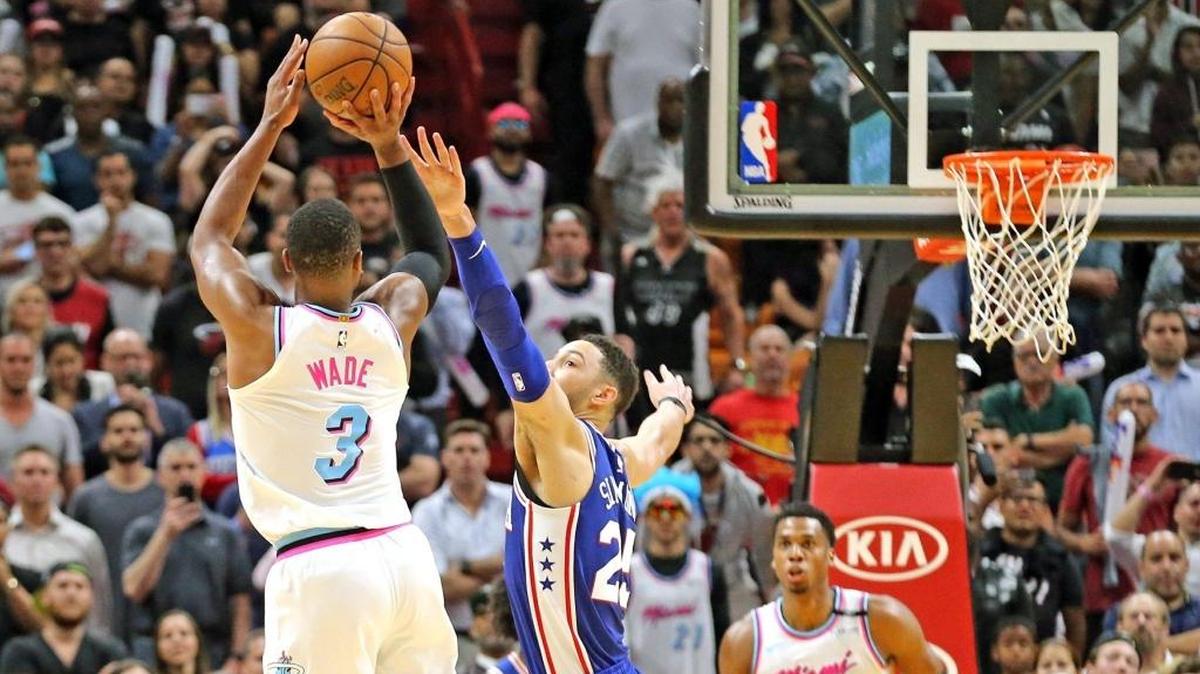 Heat's Dwyane Wade shoots over 76ers' Ben Simmons in meeting earlier this season.