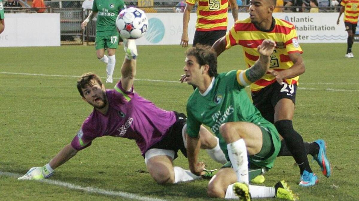 
Stefano Pinho, bottom right, of the Fort Lauderdale Strikers attempts to score during a game against the Cosmos in April. 
