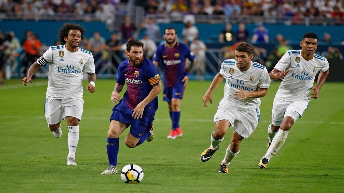 Barcelona forward Lionel Messi vies with Real Madrid defender Marcelo and midfielder Mateo Kovacic during the second half of ''El Clásico Miami'' Barcelona-Real Madrid match as part of the International Champions Cup on Saturday, July 29, 2017, at Hard Rock Stadium in Miami Gardens.
