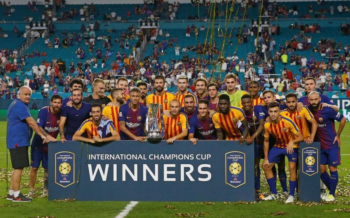 Barcelona’s team poses with the trophy on the Hard Rock Stadium field after defeating Real Madrid 3-2 on Saturday night in El Clasico Miami as part of the International Champions Cup. It was the first time the two Spanish soccer teams played against each other in the United States.