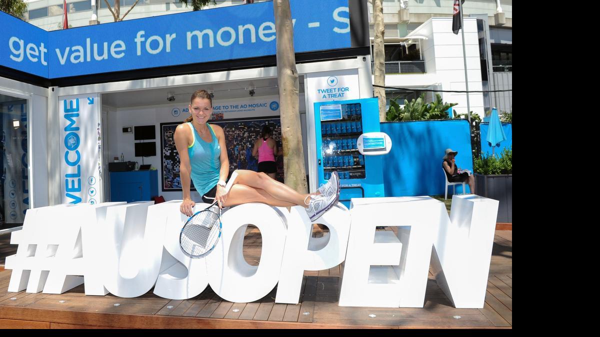 
Agnieszka Radwanska of Poland poses on Ausopen hashtag sign during the 2015 Australian Open at Melbourne Park on January 22, 2015 in Melbourne, Australia. 
