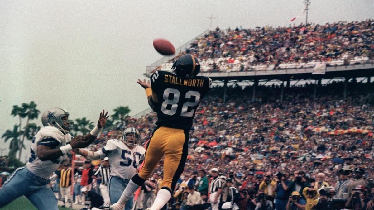 Pittsburgh Steelers wide receiver John Stallworth (82) goes high to haul in a touchdown pass from Terry Bradshaw against the Dallas Cowboys in the first quarter of Super Bowl XIII in Miami, on Jan. 21, 1979.
