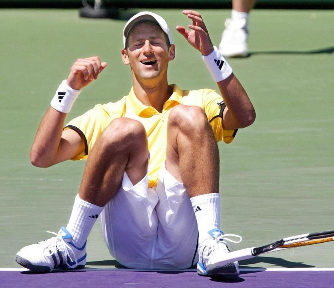 Novak Djokovic of Serbia falls to the ground in joy as he beats Guillermo Canas of Argentina in the 2007 Sony Ericsson Open final on April 1, 2007.
