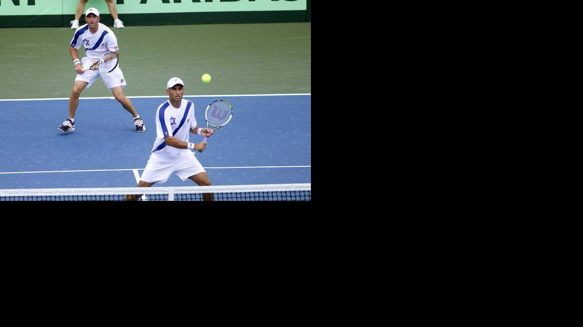 
Marathon victory: Israel’s Jonathan Erlich watches as doubles partner Andy Ram, foreground, hits a return during Saturday’s 3
1/2-hour 6-3, 3-6, 6-1, 3-6, 6-3 win against Argentina. 
