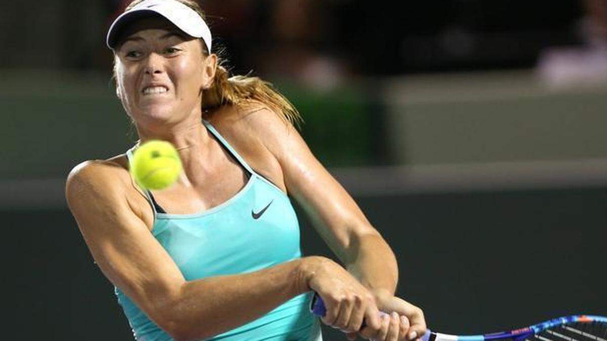 Maria Sharapova returns a ball hit by Daria Gavriola at the Miami Open in Key Biscayne, Florida, March 26, 2015.