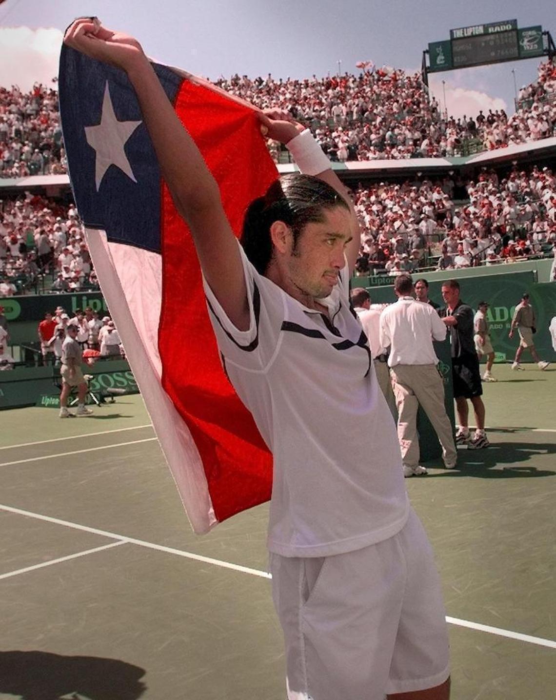 Marcelo Rios defeats Andre Agassi in three straight sets to win the Lipton Championship and propel himself to the No. 1 ranking. Rios waves the Chilean flag after the victory on March 29, 1998.