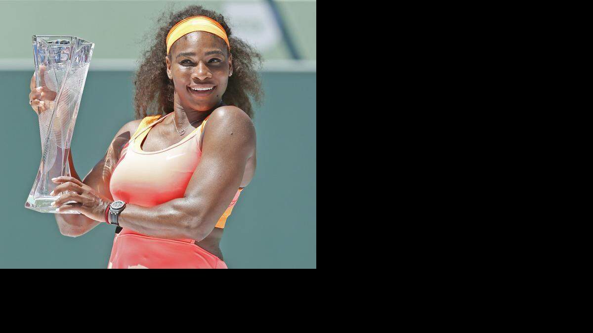 
Serena Williams holds her trophy after defeating Carla Suarez Navarro in the Miami Open at Crandon Park Tennis Center in Key Biscayne on April 4, 2015.
