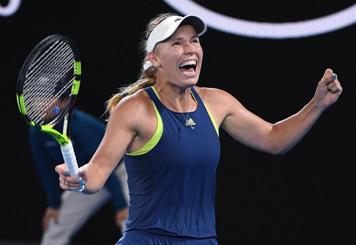 Denmark's Caroline Wozniacki celebrates after defeating Romania's Simona Halep in the women's singles final at the Australian Open tennis championships in Melbourne, Australia, on Jan. 27, 2018.