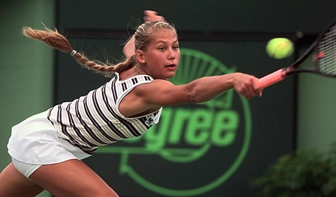 Anna Kournikova's hair goes flying as she lunges for a volley during her straight set upset of fifth seed Monica Seles at the Lipton Championships on Key Biscayne on March 23, 1998.
