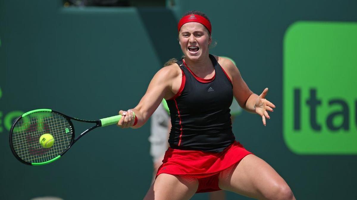 Jelena Ostapenko returns a shot against Elina Svitolina, of Ukraine, during their match at Miami Open tennis tournament on Wed., March 28, 2018 at Crandon Park Tennis Center in Key Biscayne.