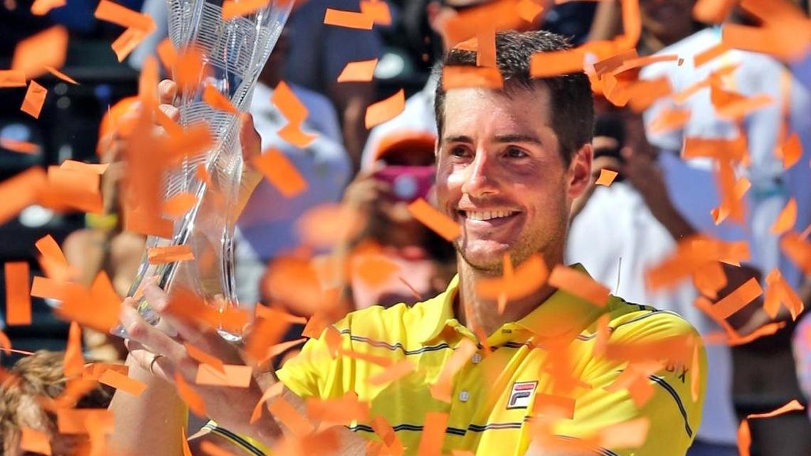 John Isner holds the trophy after defeating Alexander Zverev in three sets at the Men's Final at the Miami Open on Key Biscayne, Florida, April 1, 2018.
