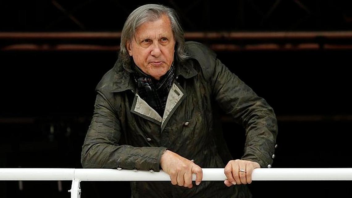 In this May 23, 2016 picture, former Romanian tennis ace Ilie Nastase watches a French Open match at the Roland Garros stadium, in Paris, France. Saturday, Nastase was thrown out of the venue hosting the Fed Cup World Group II playoff against Britain after abusive comments led to the playoff being suspended.