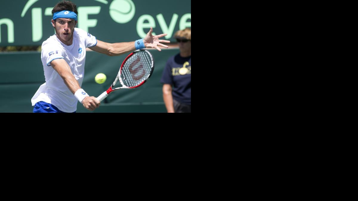 
Leonardo Mayer, of Argentina, returns the ball to Bar Truf Botzer, of Israel, during Davis Cup tennis play in Sunrise, Fla., Friday, Sept. 12, 2014. 
