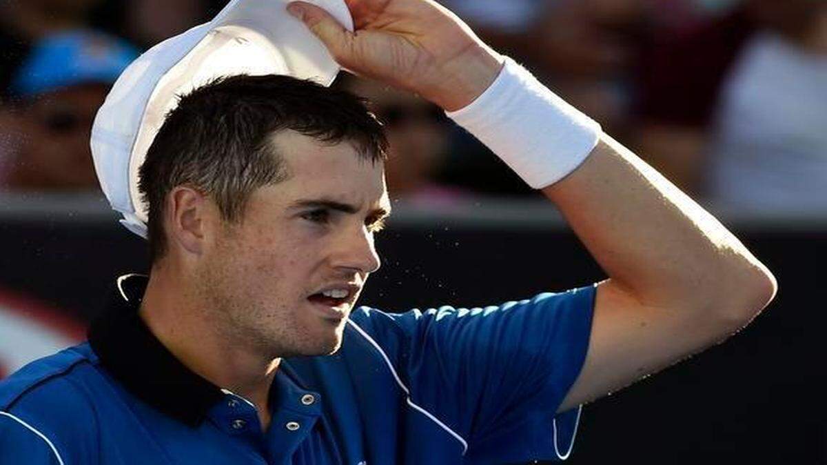 
John Isner of the U.S. rests as he plays Gilles Muller of Luxembourg during their third round match at the Australian Open in Melbourne, Australia, Saturday, Jan. 24, 2015.
