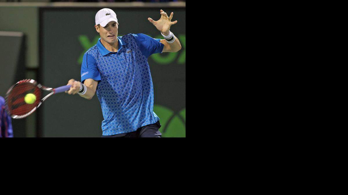 
John Isner hits a shot against Nicolas Almagro at the Sony Open tennis tournament in Key Biscayne on March 24, 2014.
