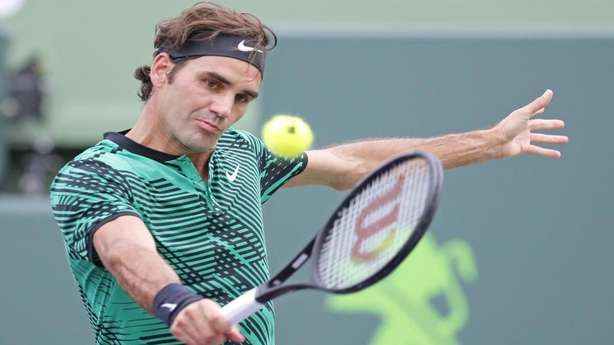 Roger Federer hits to Frances Tiafoe during men's singles match at the Miami Open Tennis tournament, presented by Itau, at Crandon Park Tennis Center in Key Biscayne, Fla., on Saturday, March 25, 2017.